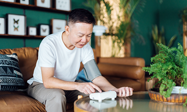 Man taking his own blood pressure