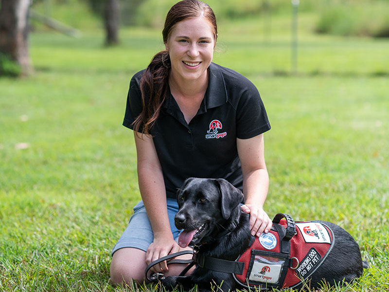 Woman with black lab