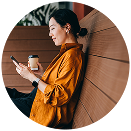Woman at work looking at mobile phone