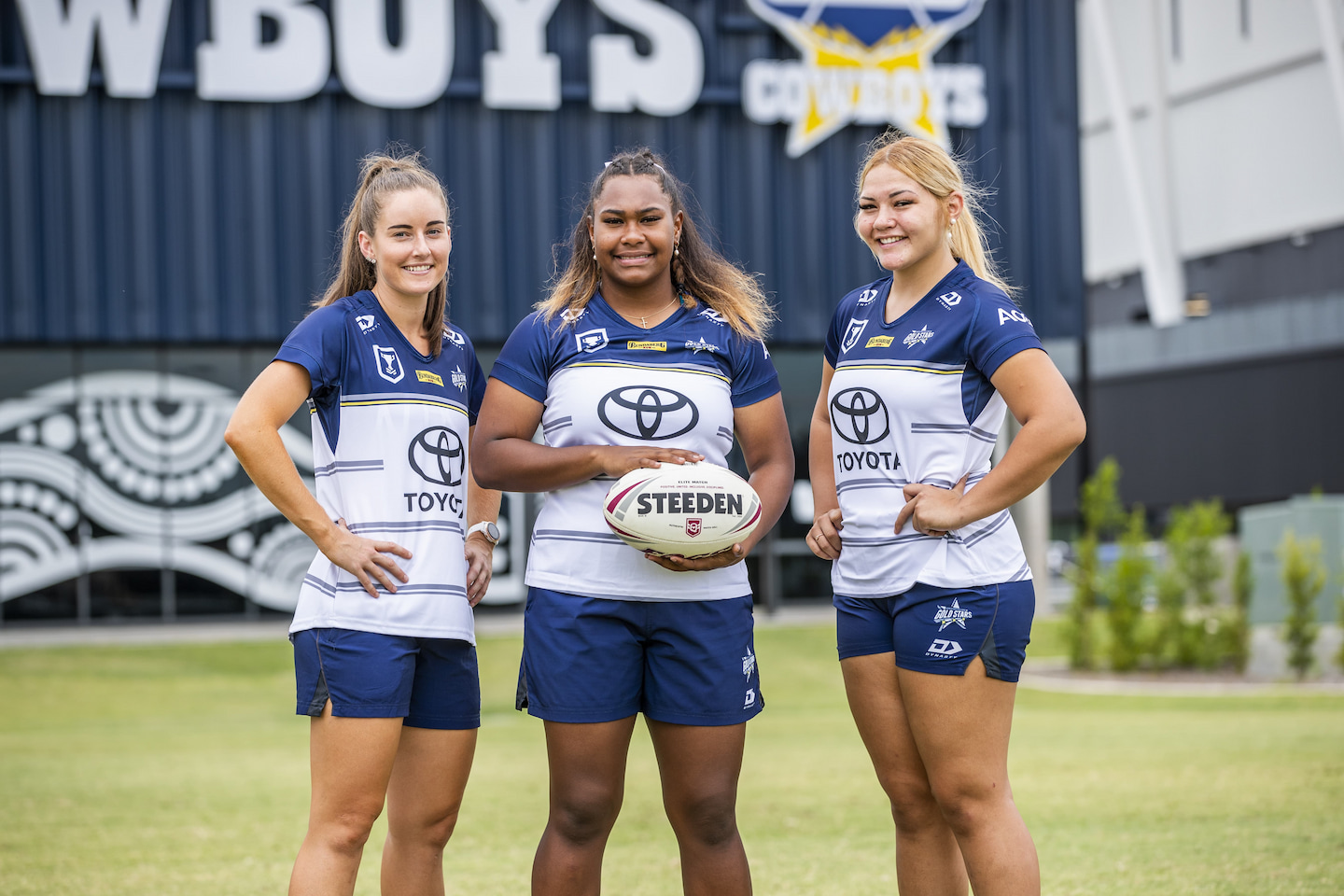Three North Queensland Gold Stars players with football