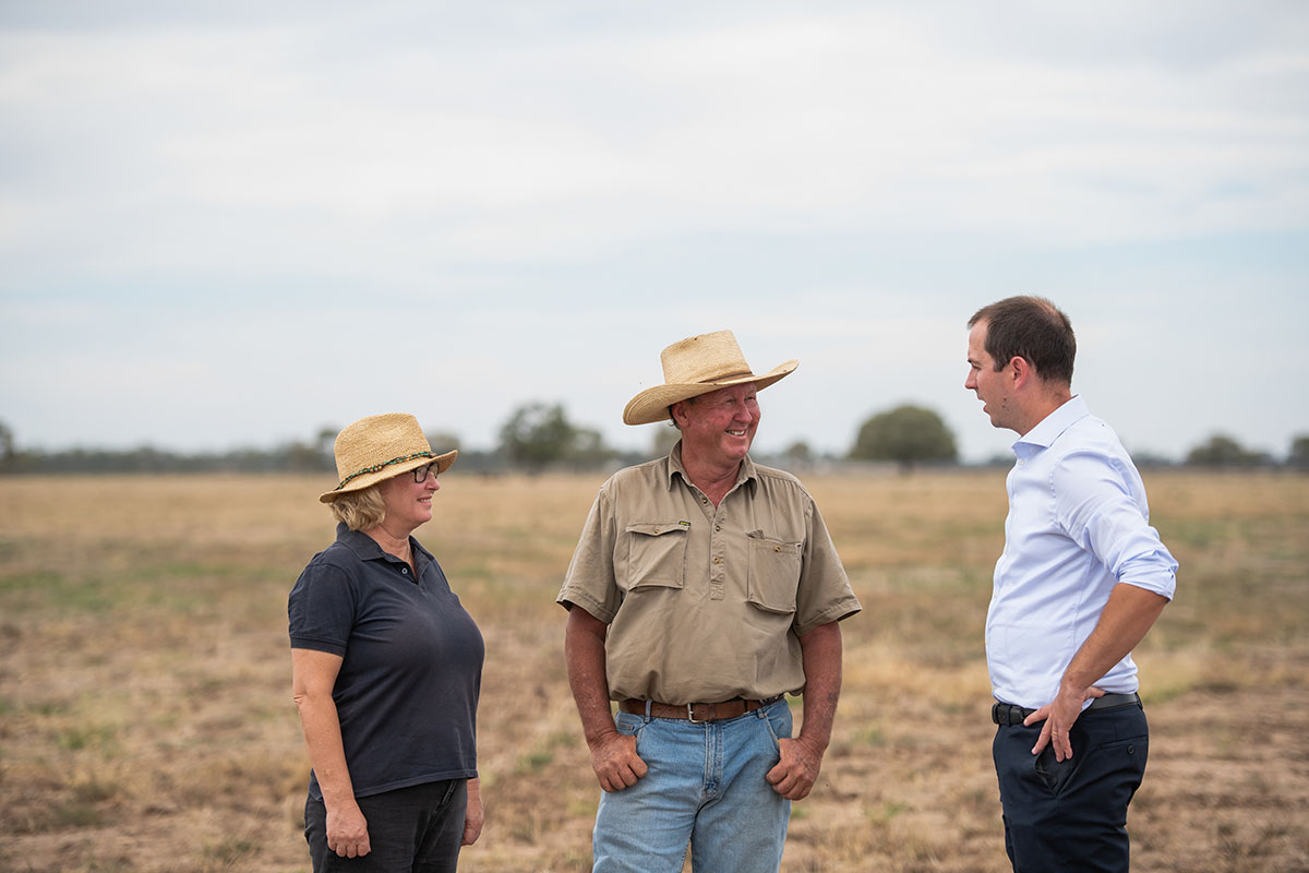 Farmers chatting with man
