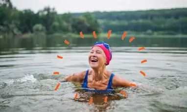 older woman swimming in lake