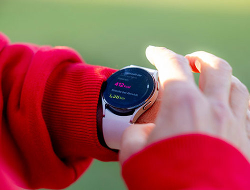 Woman looking at wearable tech watch