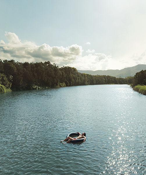 man floating on river